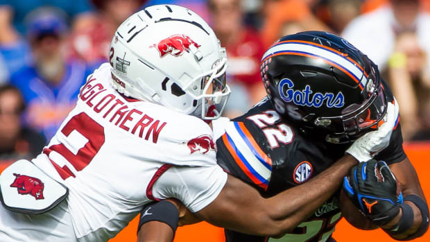Razorbacks' defensive back Dwight McGlothern making a tackle against Florida